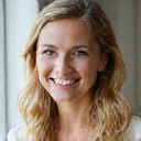 Portrait of a smiling woman, a client of Healthy Nutrition Makassar, looking healthy and happy.